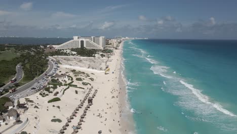 low flight along cancun sandy beach toward iberostar resort hotel