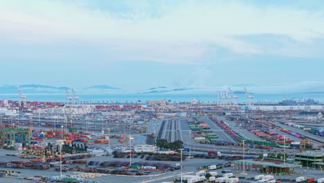 the drone pans across a bustling harbor scene filled with industrial life and coastal energy.