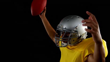 American-football-player-cheering-with-ball-in-his-hand-4k