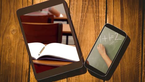 animation of a digital tablet with a open notebook lying in a classroom and a smartphone