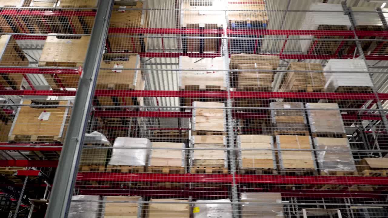 High Bay Warehouse Storage Racks Filled with Goods and Pallets