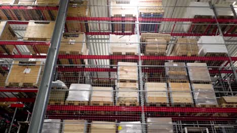 high bay warehouse storage racks filled with goods and pallets