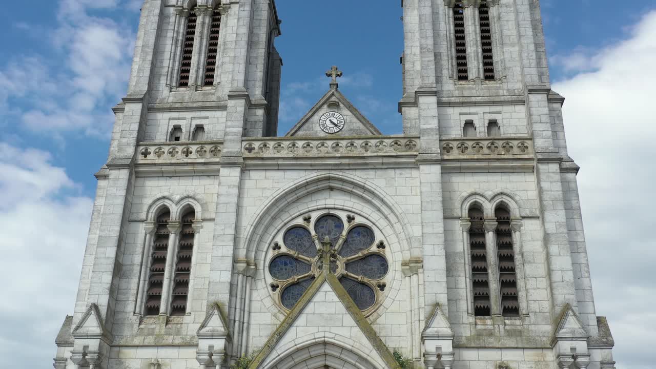 Stunningly beautiful Gothic style French church in Neuvizy in the Ardennes.  Drone rising dolly up,  close up.