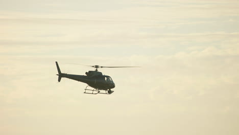 a helicopter flys through the desert in morocco