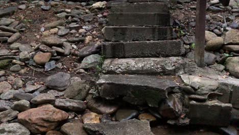 creepy rock stairs leading into river