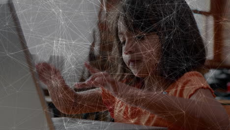 animation of data processing over caucasian girl using laptop