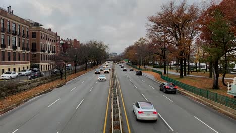 cars driving on highway in light traffic in slow motion