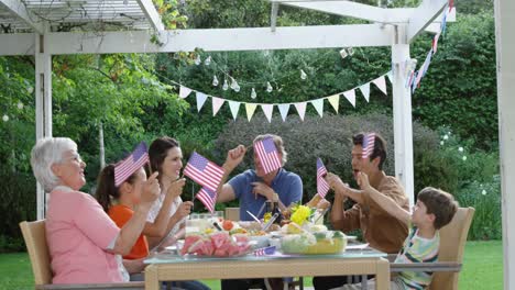 family eating outside together in summer