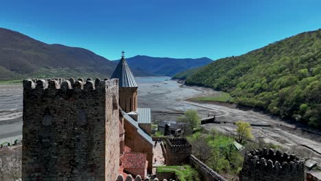 Flight-Over-Ananuri-Fortress-Complex-In-Georgia-At-Daytime---drone-shot