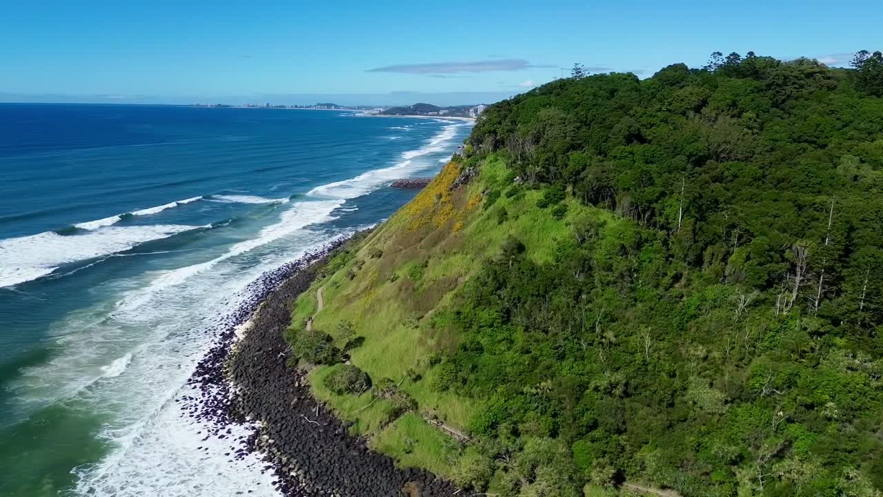 Stunning drone video of Burleigh Head National Park from the ocean, showing Gold Coast Southern beaches