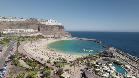 aerial view of amadores beach, scenic turquoise water bay, gran canaria