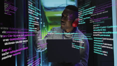 animation of data processing over african american male engineer using laptop working at server room