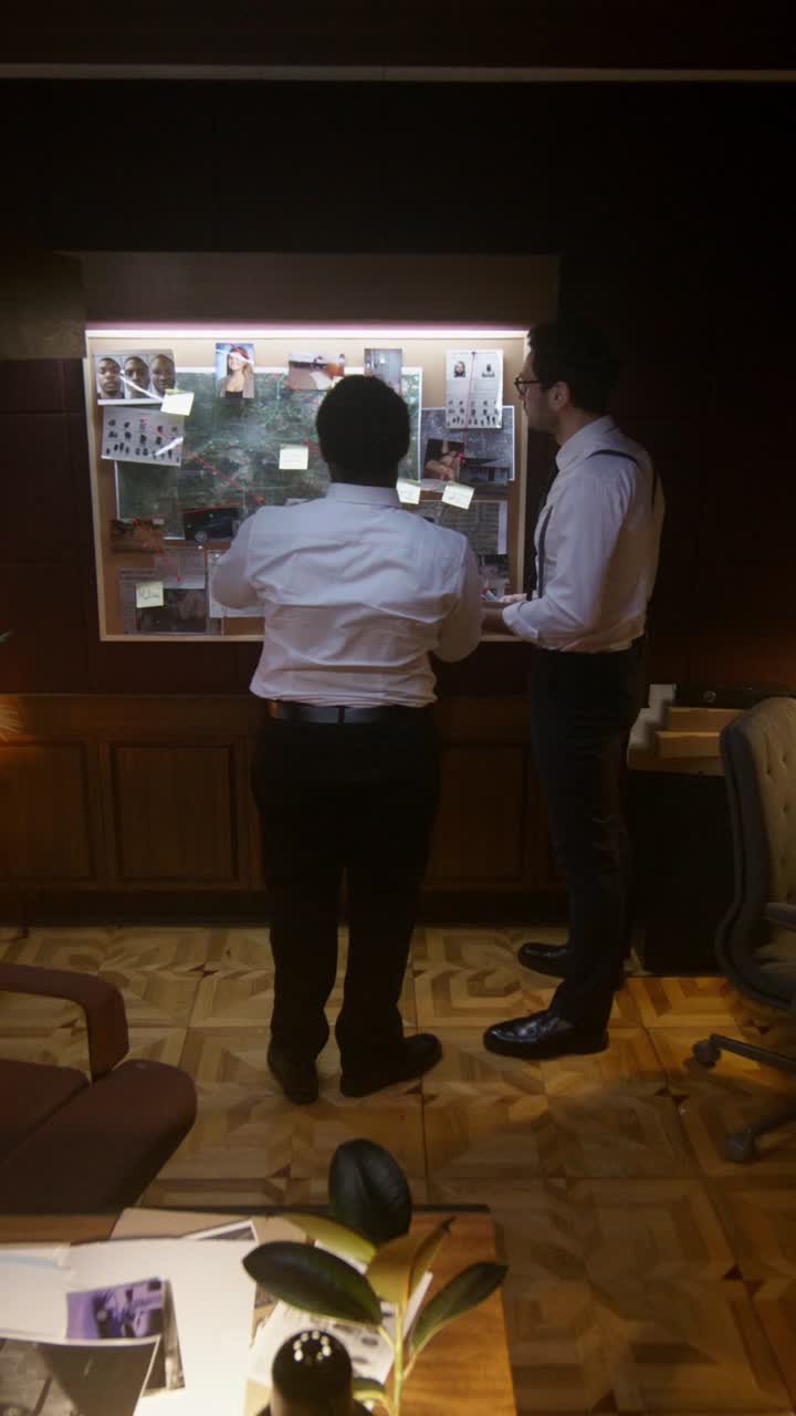 Detectives reviewing evidence