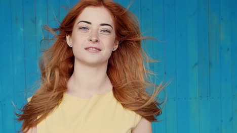 woman with red hair in a yellow dress