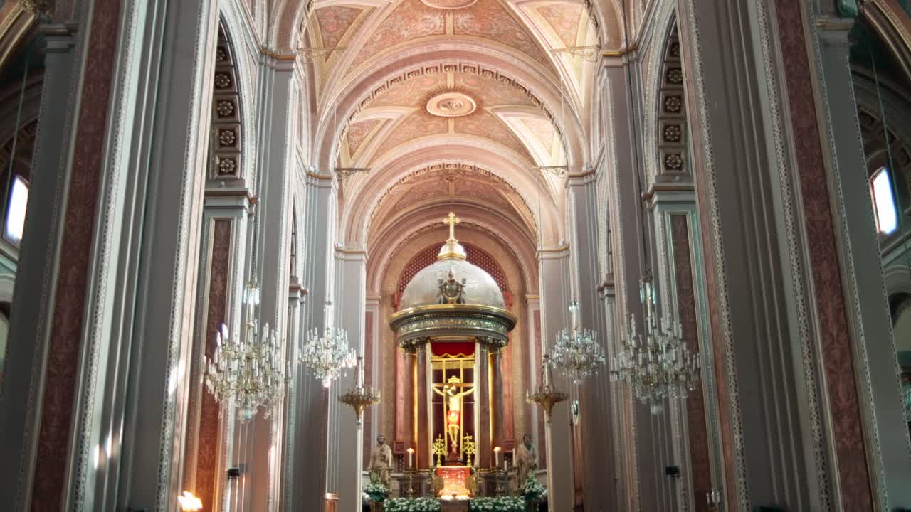 SLOW MOTION HANDHELD SHOT OF THE INTERIOR OF THE CATHEDRAL OF MORELIA