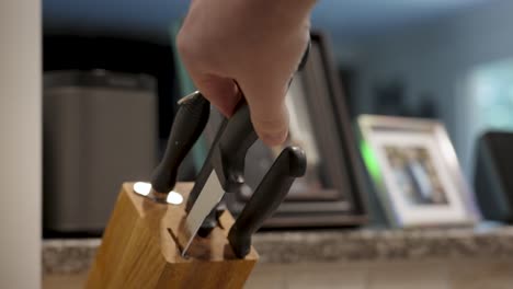 a large and skinny knife pulled from the block.