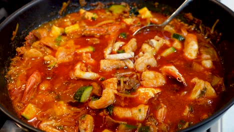 asian spicy hotpot and korean spicy soup boiling in pot