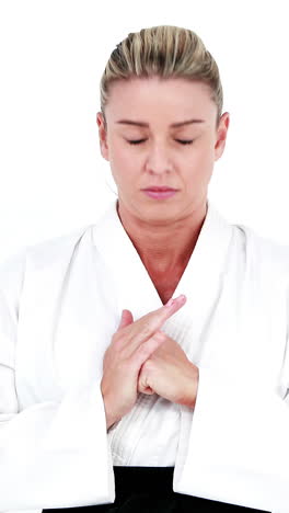 serious sportswoman practices judo