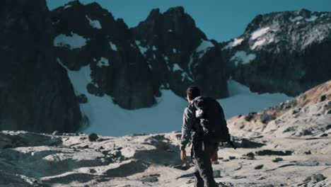 man trekking ojo del albino glacier in ushuaia, argentina - wide shot