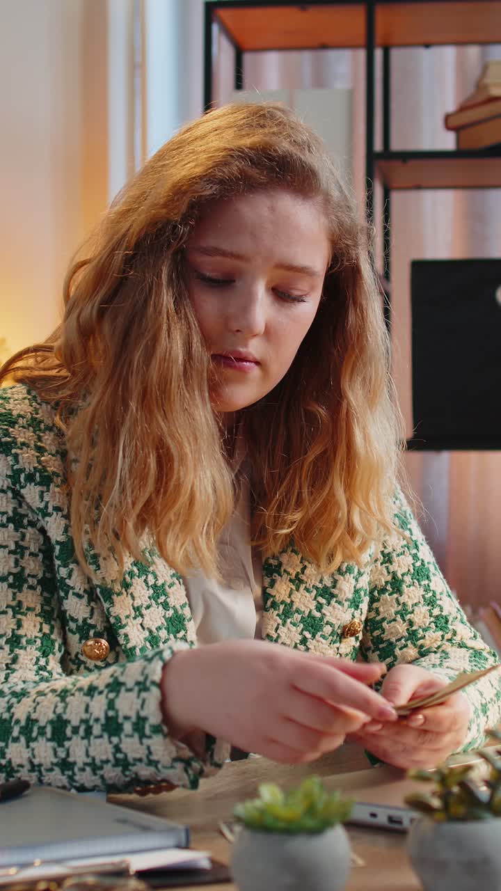 Business woman freelancer counting cash insufficient amount of money financial crisis bankruptcy