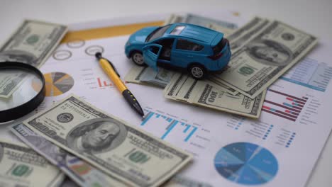 document - buying a car with euro, pen, calculator and toy car.