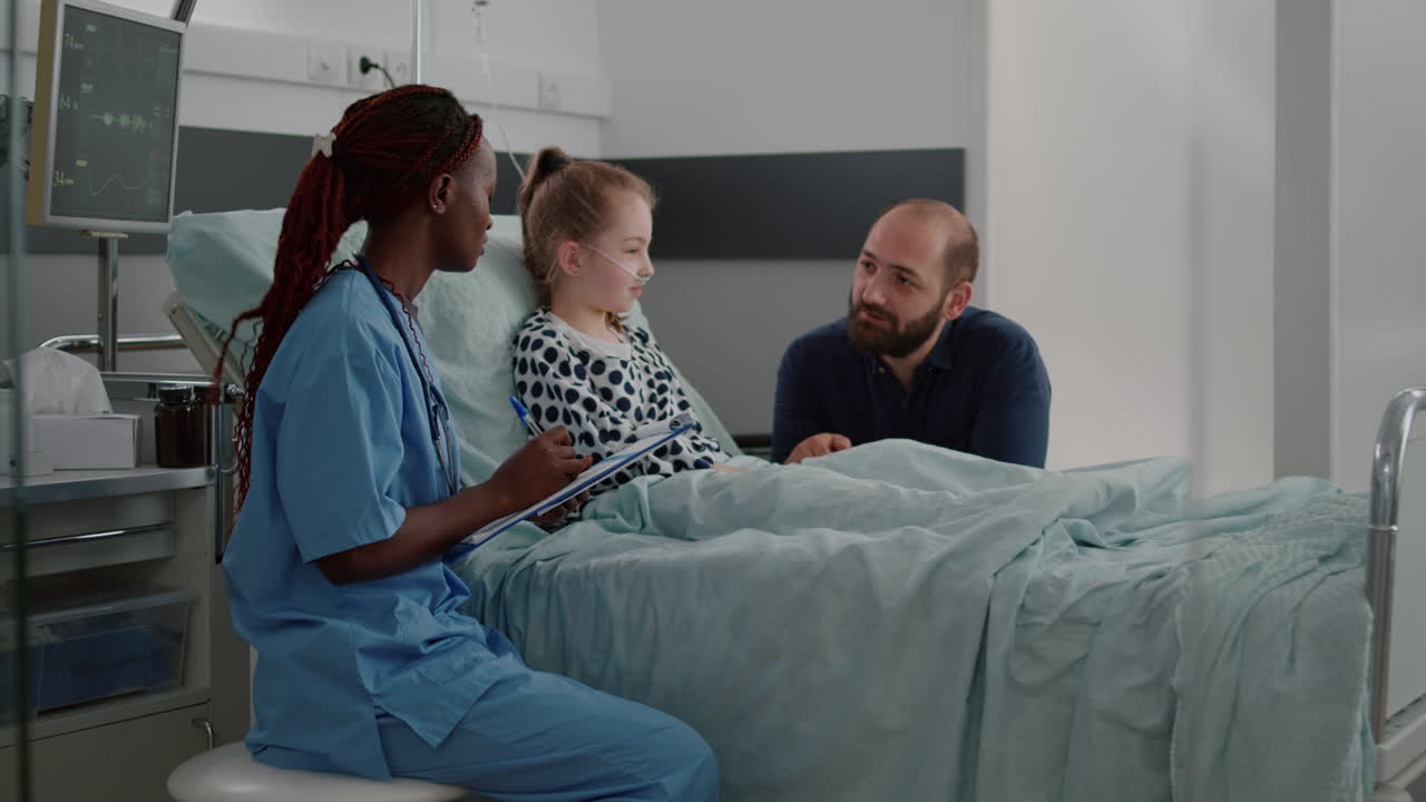 African american practitioner asisstant writing sickness symptoms on clipboard