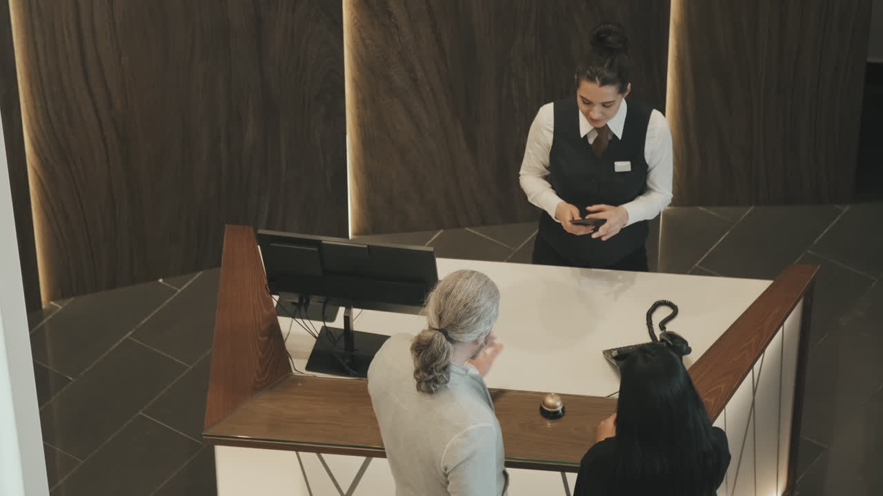 Top-View of Couple Checking-In at Hotel