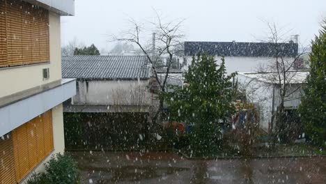 orange office building in germany during snowfall.