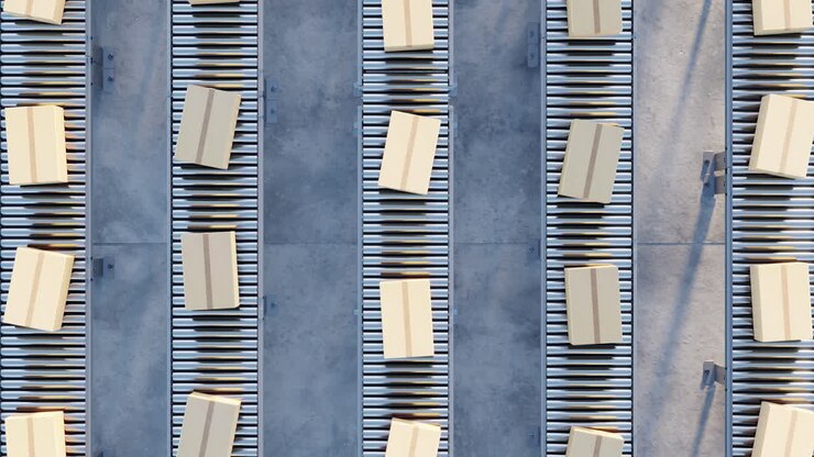 Cardboard boxes on conveyor rollers. infinite 3d loop