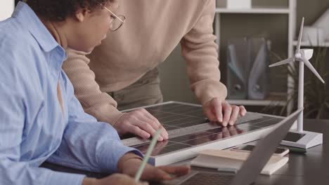 engineers measuring solar panel