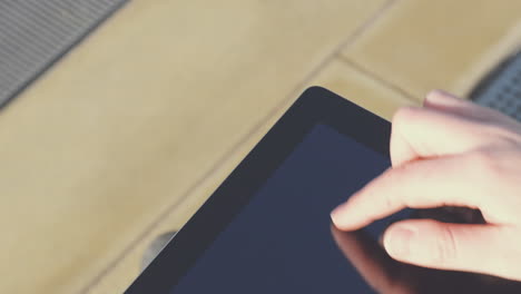 Close-up-hands-touching-tablet-computer