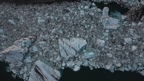 Aerial-top-down-melting-glacial-lake-in-Iceland,-global-warming,-climate-change