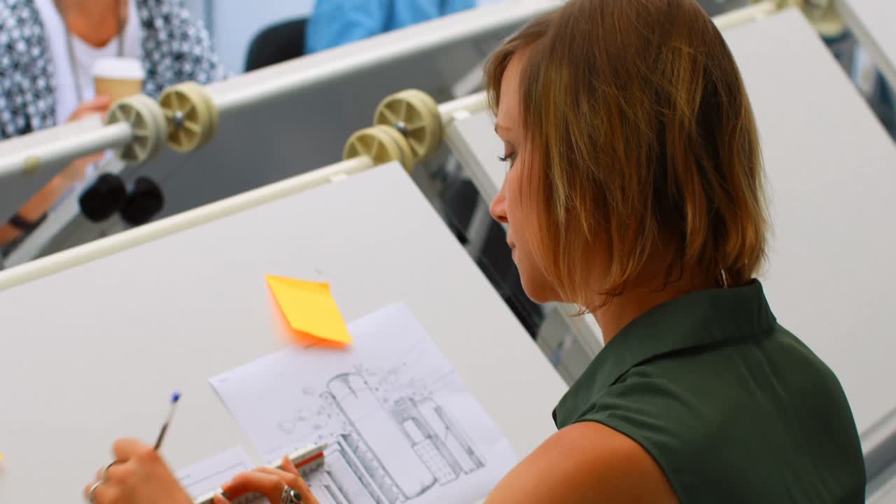 Architectures working at drafting table 4k