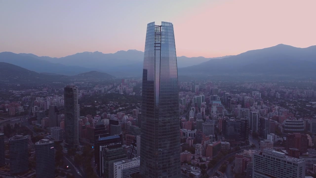 Beautiful view of modern skyscrapers with mountain range in the background in the capital of Chile, Santiago.