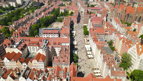 gdansk old town revealing shot - tourists visiting long market, basilica of st