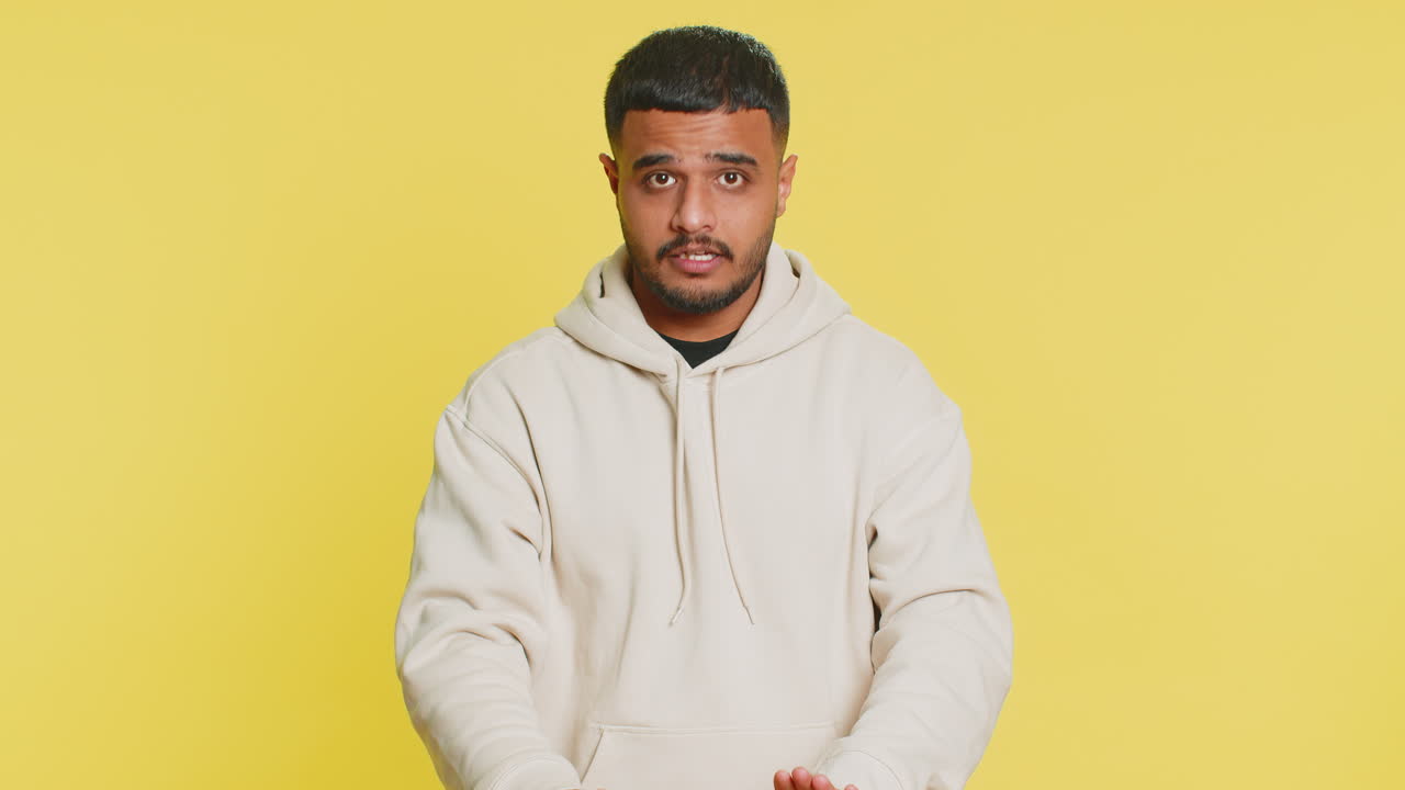 Strict indian man warning hands gesture saying no be careful advice to avoid danger caution