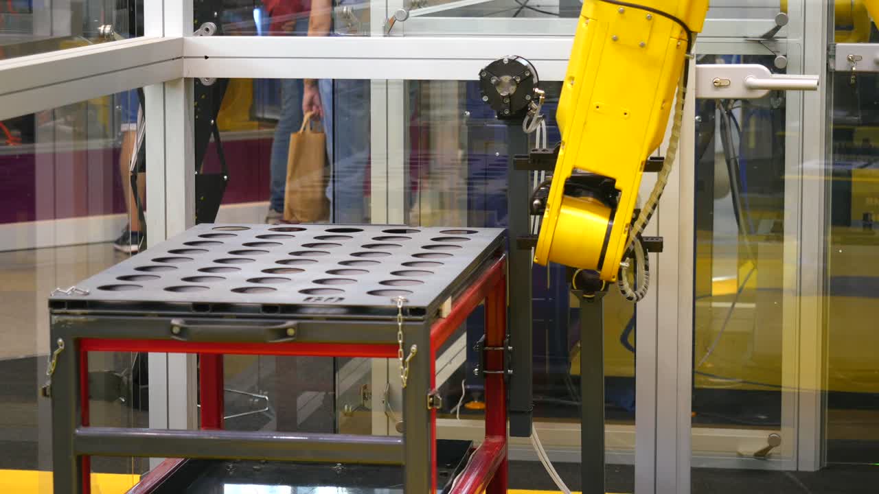 Industrial Robot Arm Operating in a Factory Setting