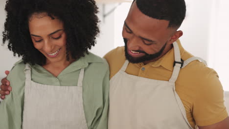 Black-couple,-talking-and-cooking-in-kitchen