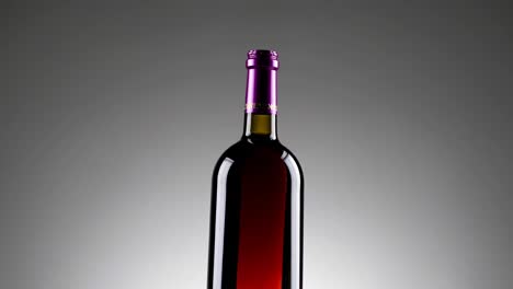 red wine bottle with pouring wine