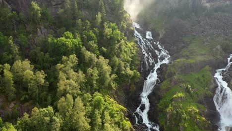 Latefossen-is-one-of-the-most-visited-waterfalls-in-Norway-and-is-located-near-Skare-and-Odda-in-the-region-Hordaland,-Norway.-Consists-of-two-separate-streams-flowing-down-from-the-lake-Lotevatnet.