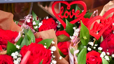 red roses bouquet with love decorations