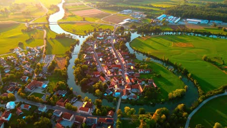 Stunning-aerial-4K-drone-footage-of-Kostanjevica-na-Krki-in-the-golden-sunset-light