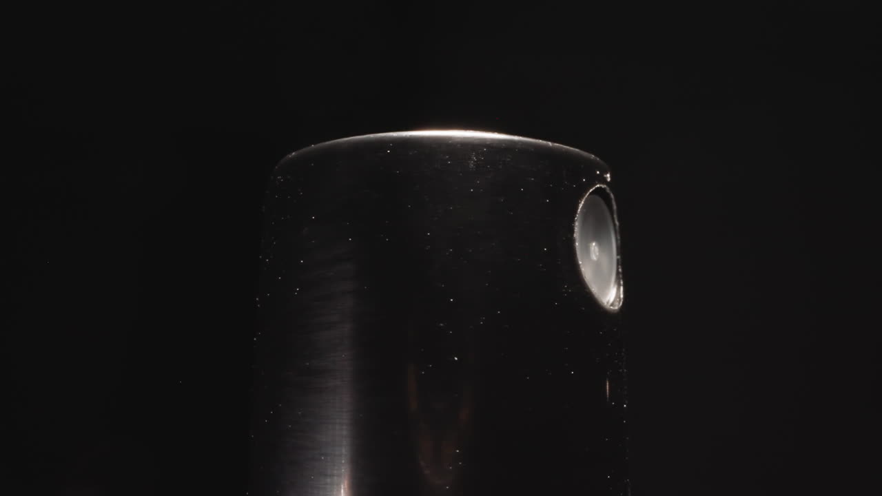 Black sprinkler cap from bottle with moisturizing spray