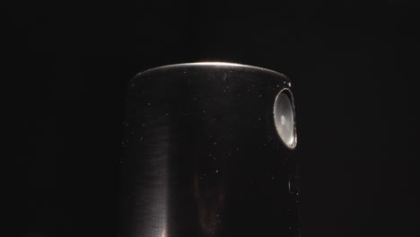 Black-sprinkler-cap-from-bottle-with-moisturizing-spray