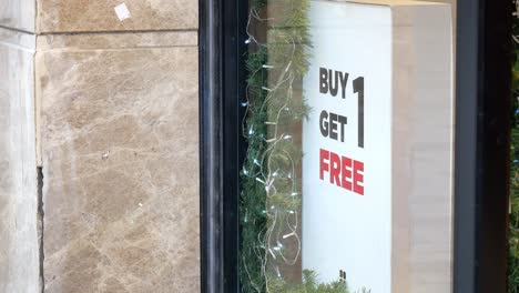 buy one get one free sign in store window