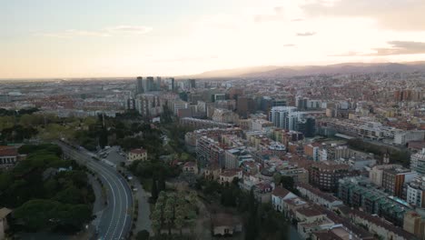 pan up reveals barcelona urban cityscape at sunset