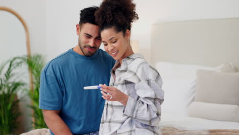 Couple,-hug-and-pregnancy-test-for-positive