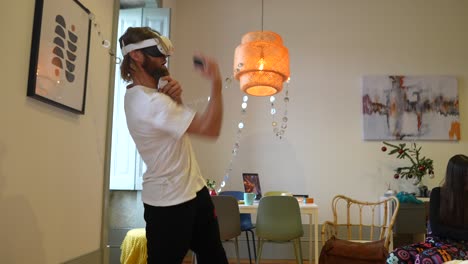 man wearing vr headset in a home with christmas decorations