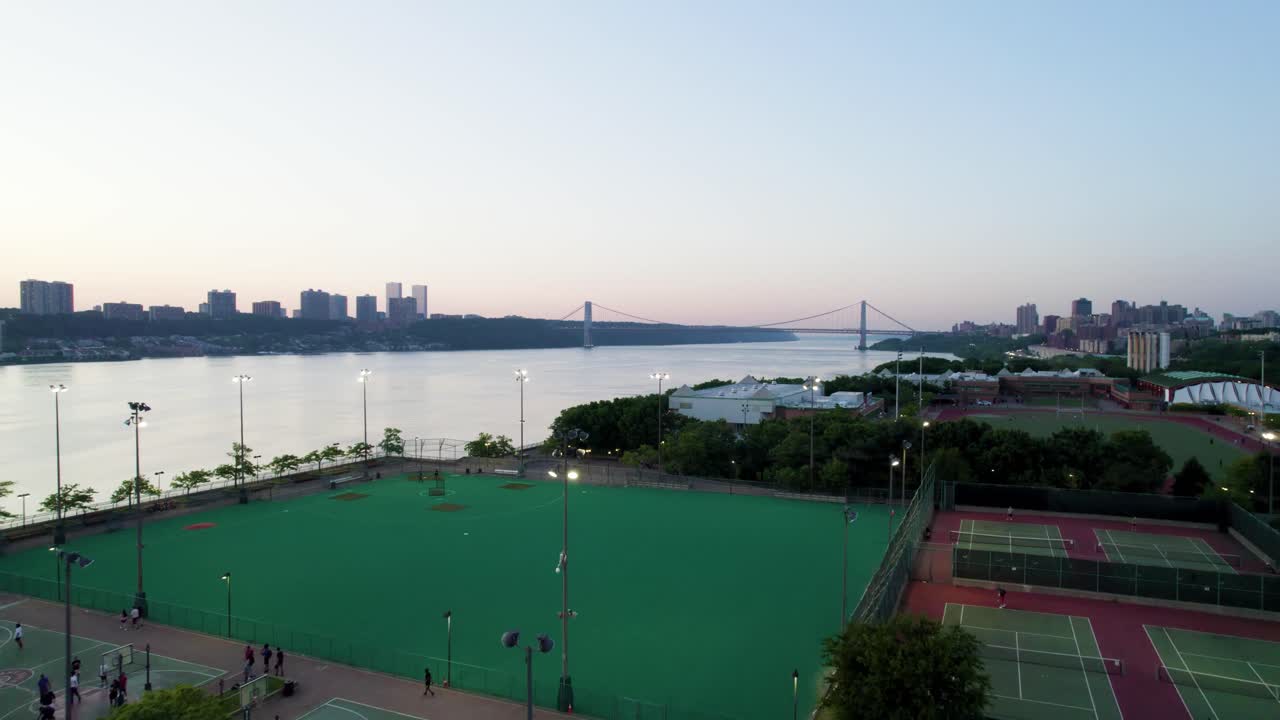 New York's Riverbank State Park at dusk with Hudson River, Sports Fields, George Washington Bridge. Aerial shot