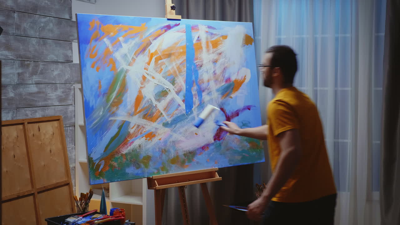 Guy painting with roller